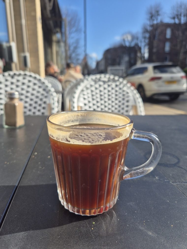 A glass mug of black filter coffee